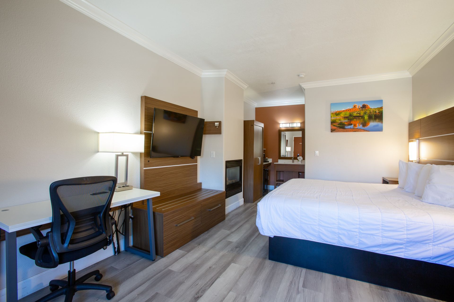 Panoramic King Fireplace room with king Beautyrest bed and gas fireplace at Wildflower Inn Sedona