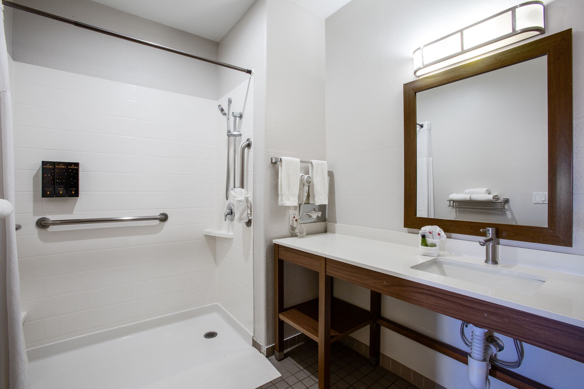 ADA-compliant washroom featuring roll-in shower and modern amenities in Wildflower Inn Sedona’s King Accessible Room