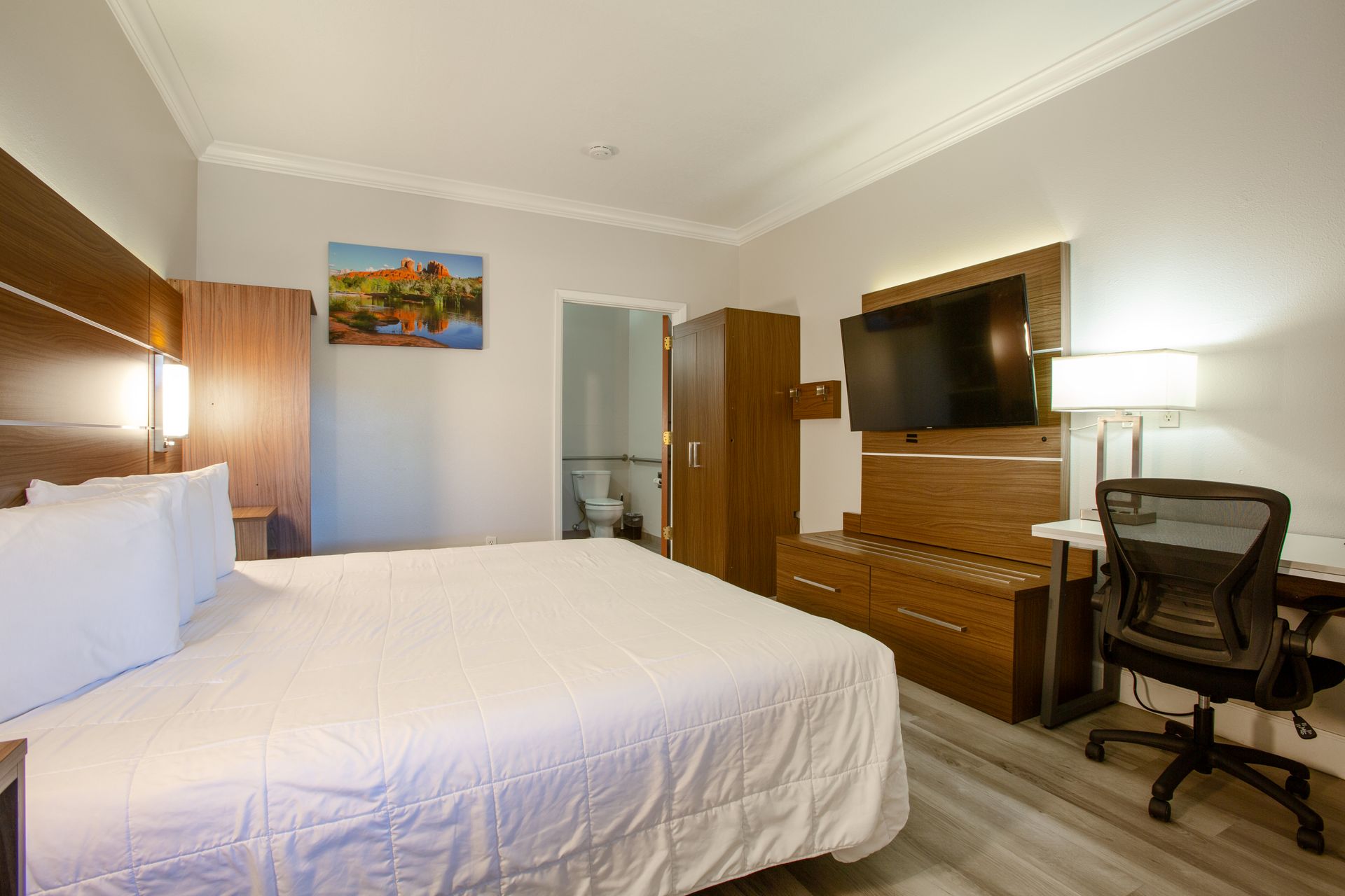 Side view of spacious king bed setup in ADA accessible room at Wildflower Inn Sedona