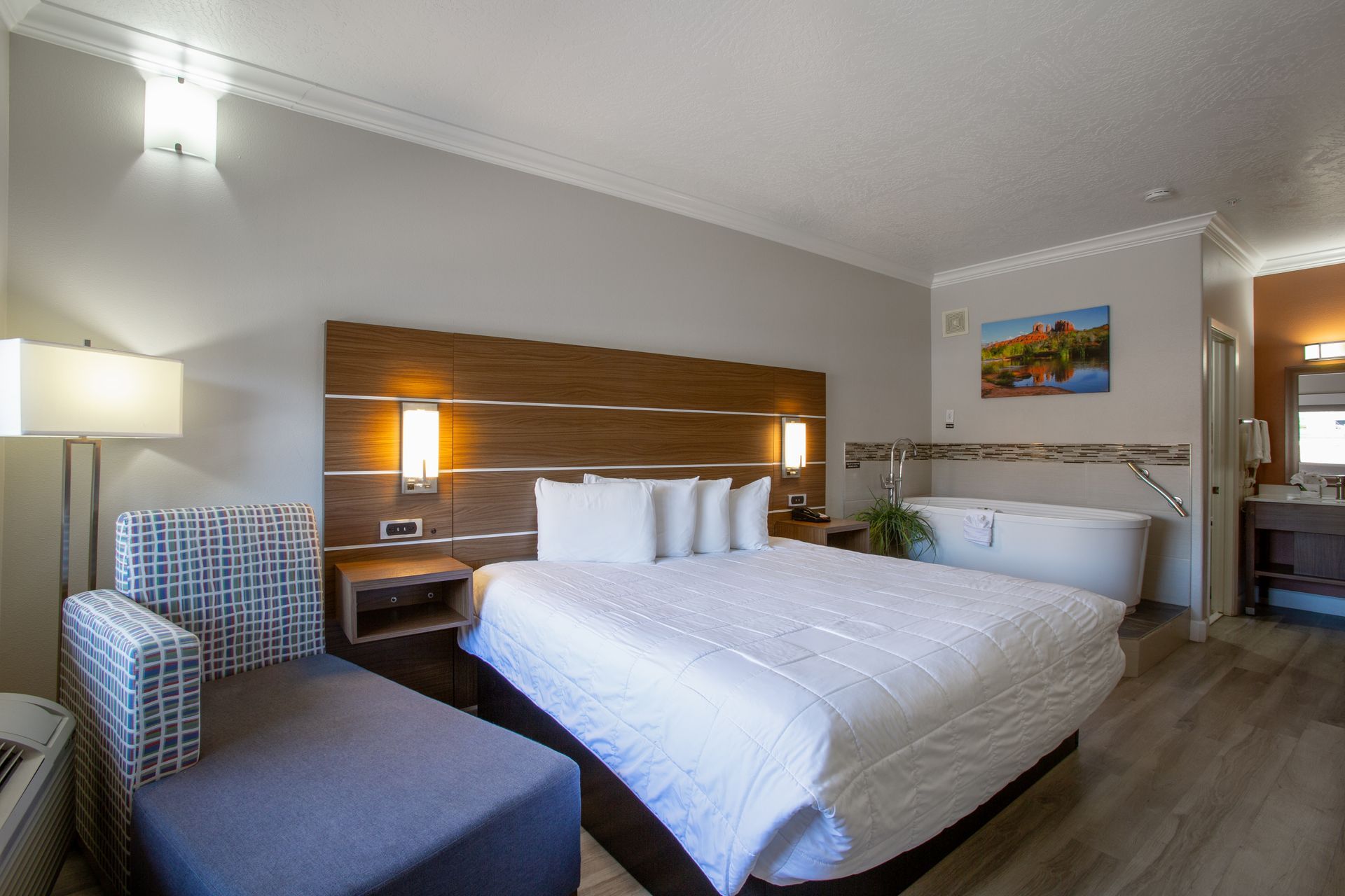 Spacious king bedroom with soaking whirlpool tub at Wildflower Inn Sedona