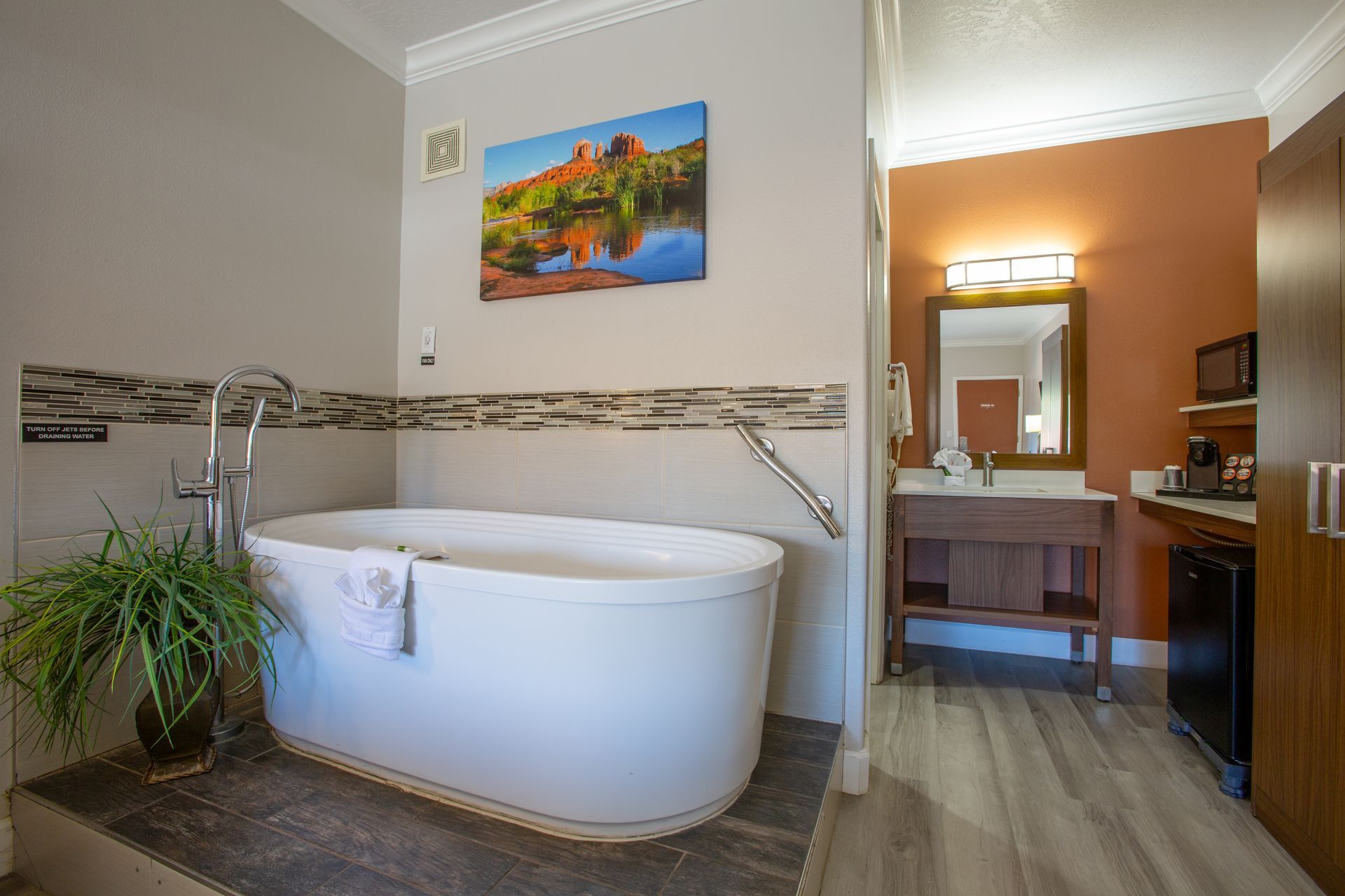 Elegant and cozy bedroom with king Beautyrest bed and jetted tub at Wildflower Inn Sedona