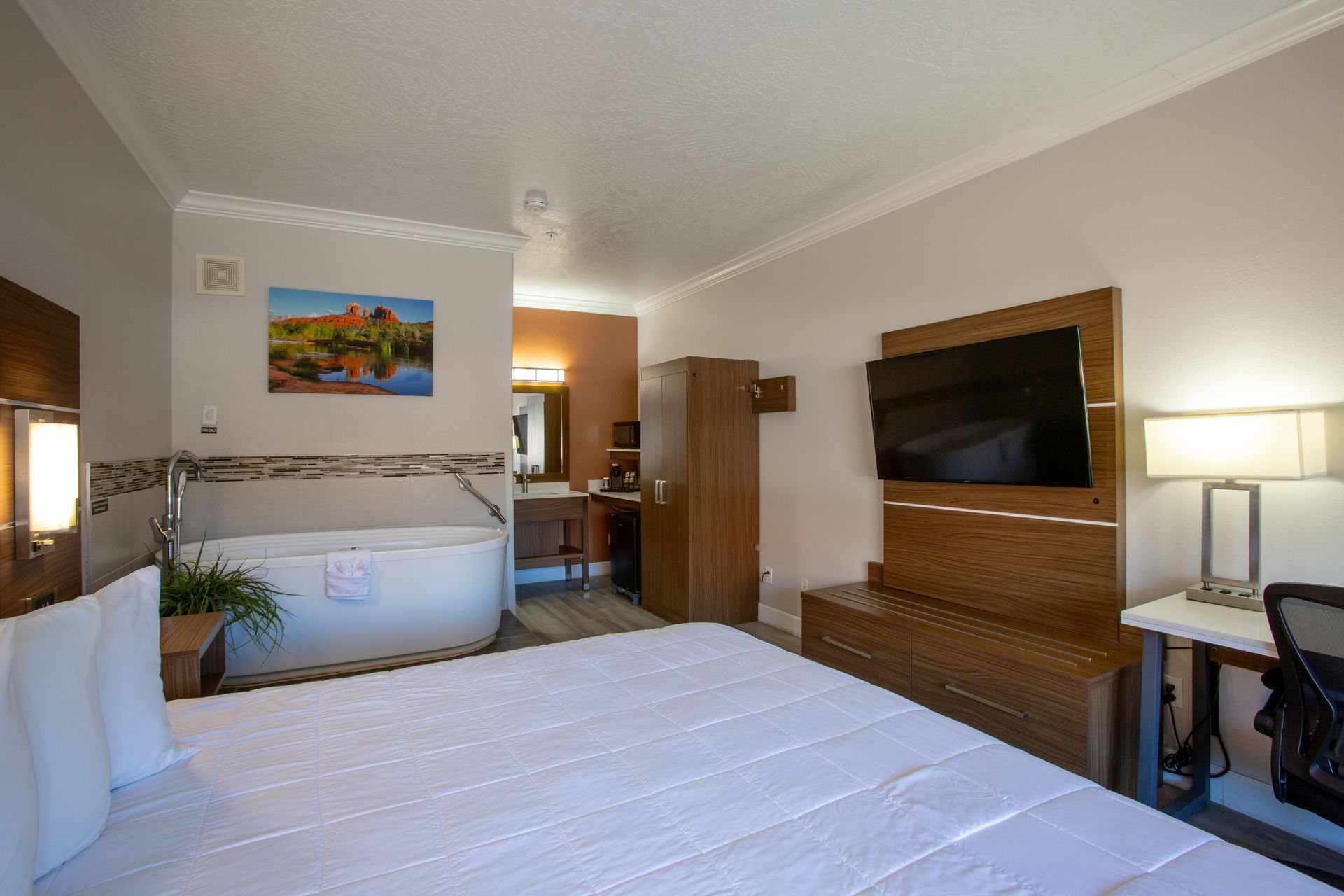King-size bed and private jetted tub in the cozy Jetted King Relaxation Retreat at Wildflower Inn