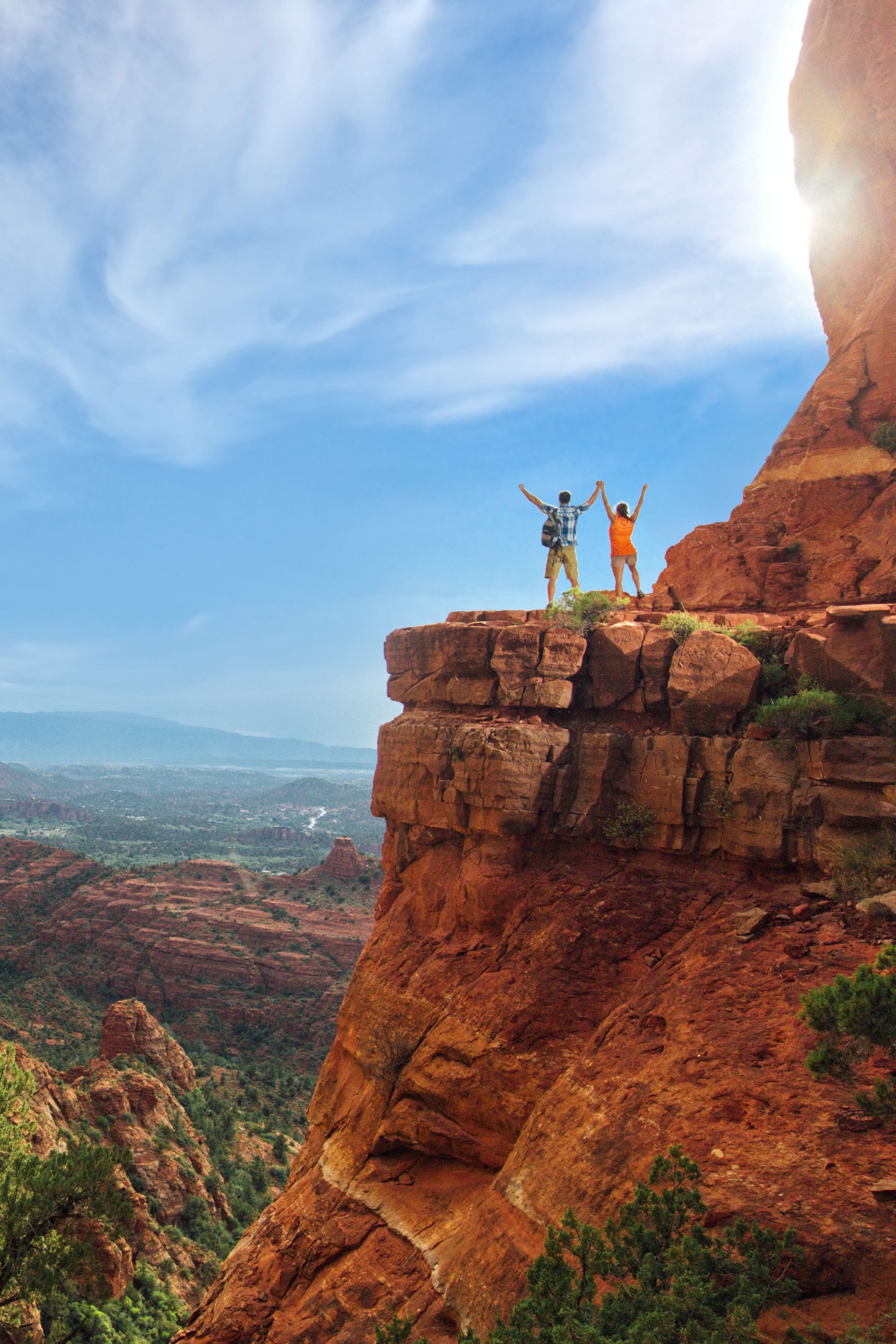Scenic view of Cathedral Rock and Bell Rock glowing under Sedona’s sunset sky