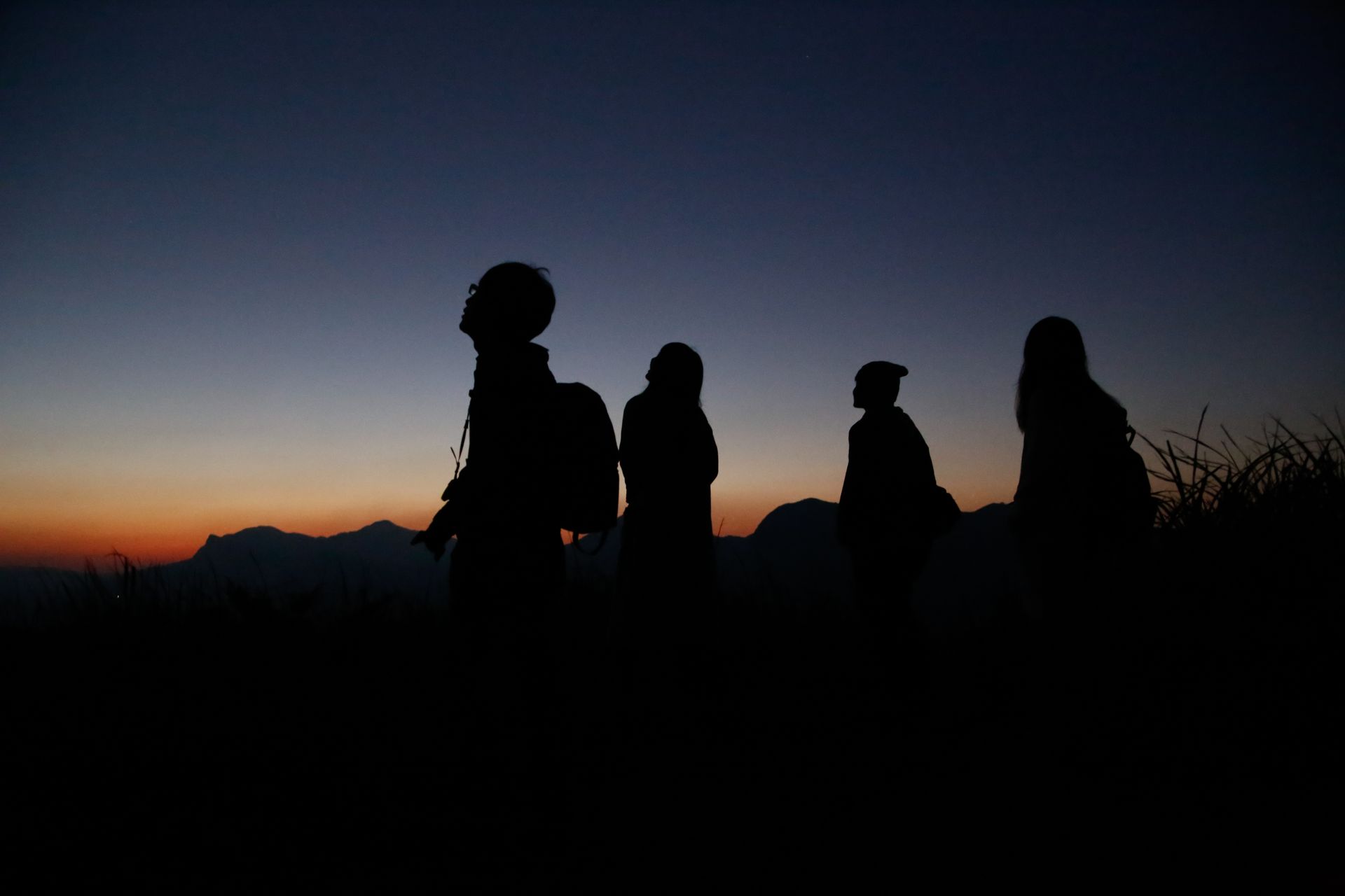 Group of friends watching sunset near Bell Rock, Sedona