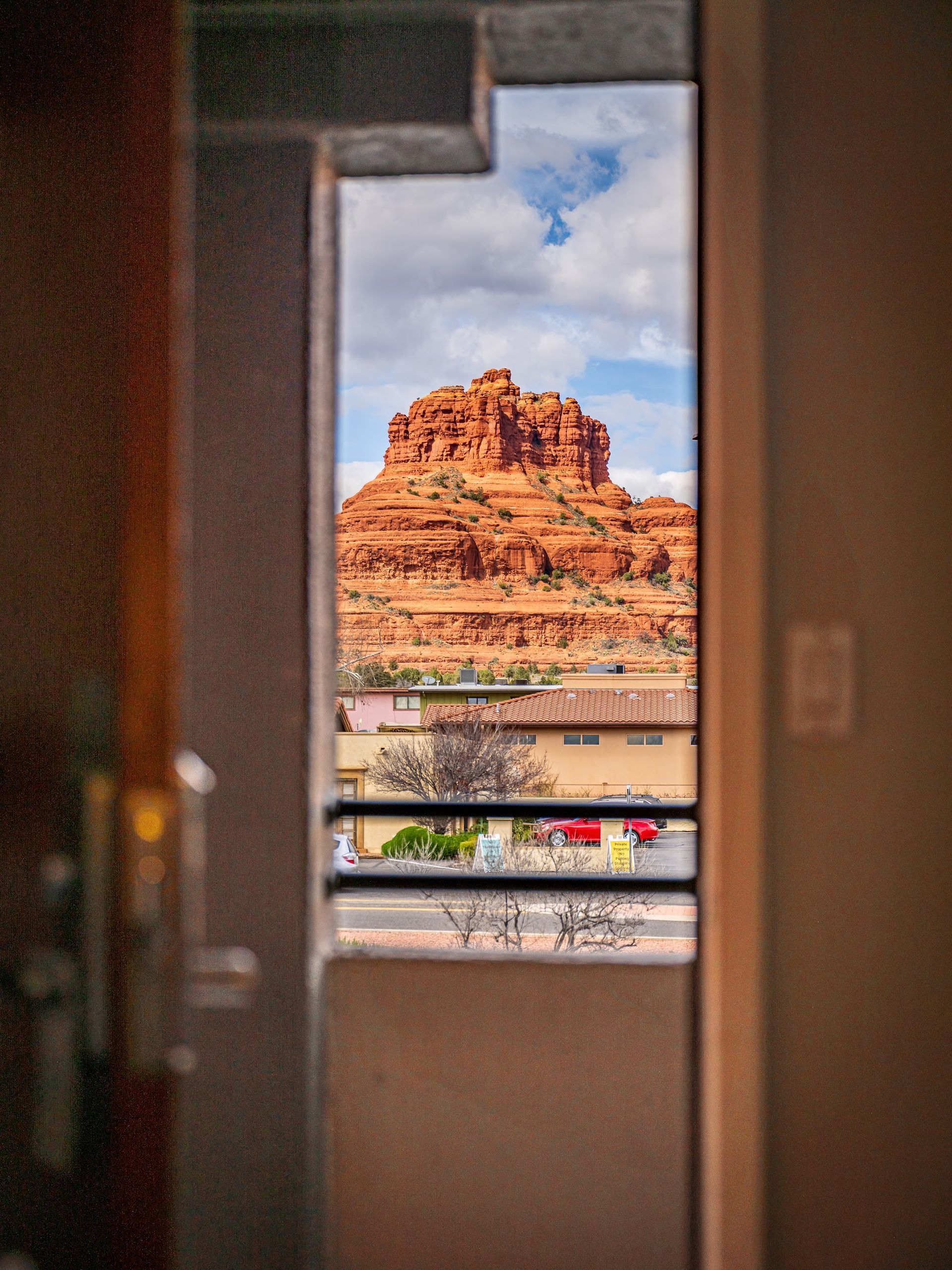 Bell Rock framed through an open guest room doorway at Wildflower Inn at Bell Rock in Village of Oak Creek Sedona