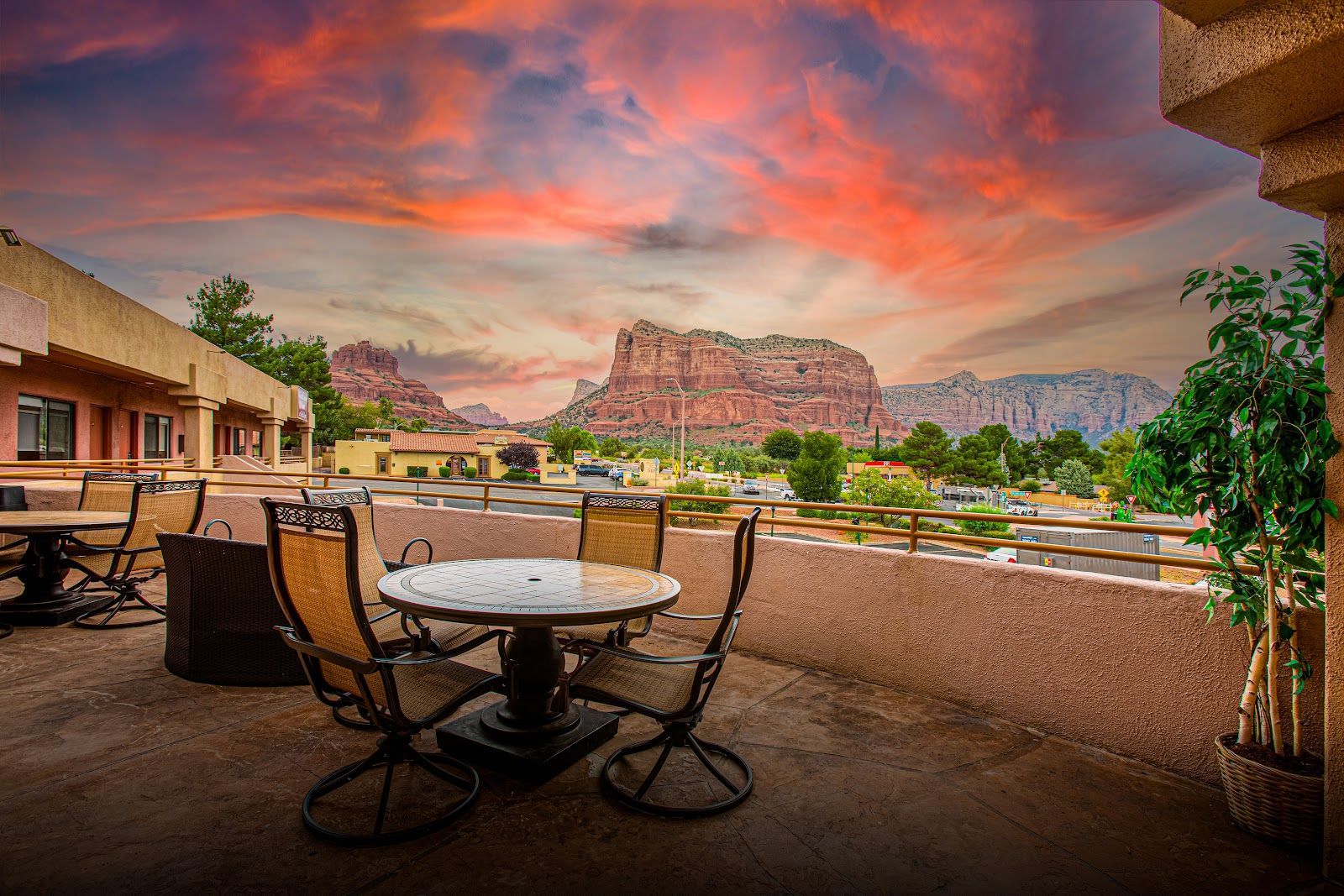 Sunset over Sedona red rocks seen from an inn patio in the Village of Oak Creek