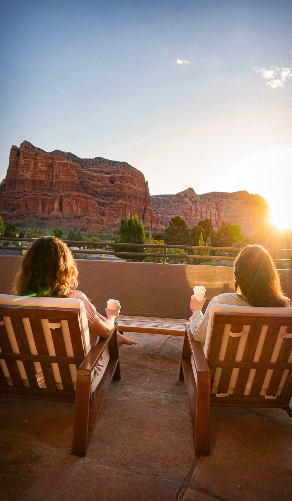 Guests on the patio at Wildflower Inn looking out toward Bell Rock in the Village of Oak Creek