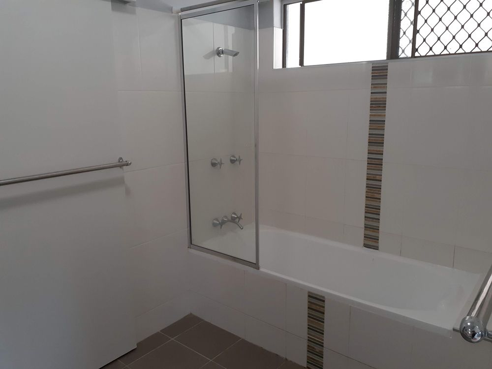 A Bathroom with A Bathtub and A Shower Stall — Cairns Vacate Clean in Manunda, QLD