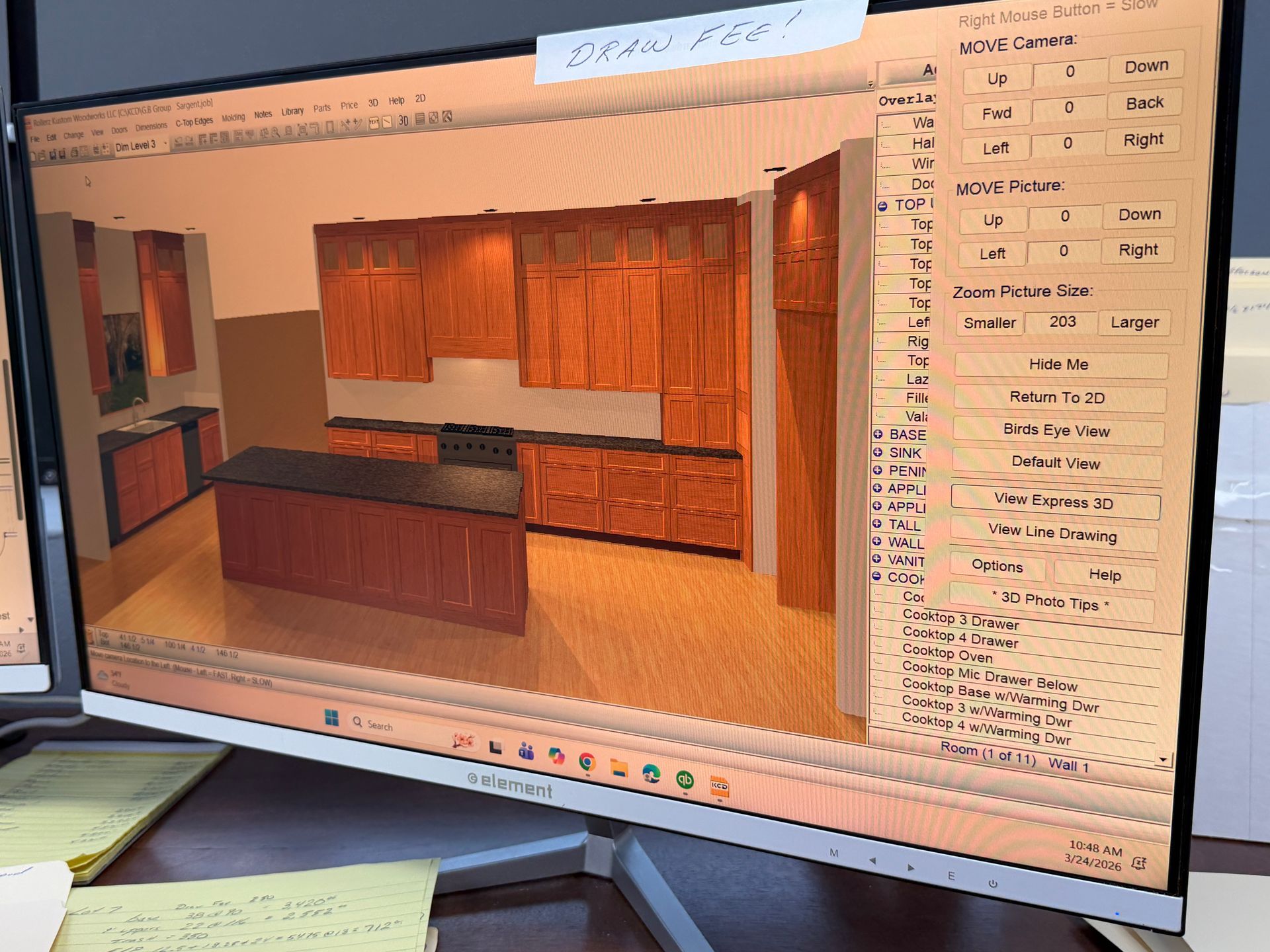 Computer monitor showing a kitchen design software with a rendered wood-toned kitchen layout