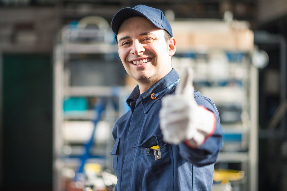 Smiling Mechanic Giving Thumbs Up — Steering & Suspension Service in West Gosford NSW