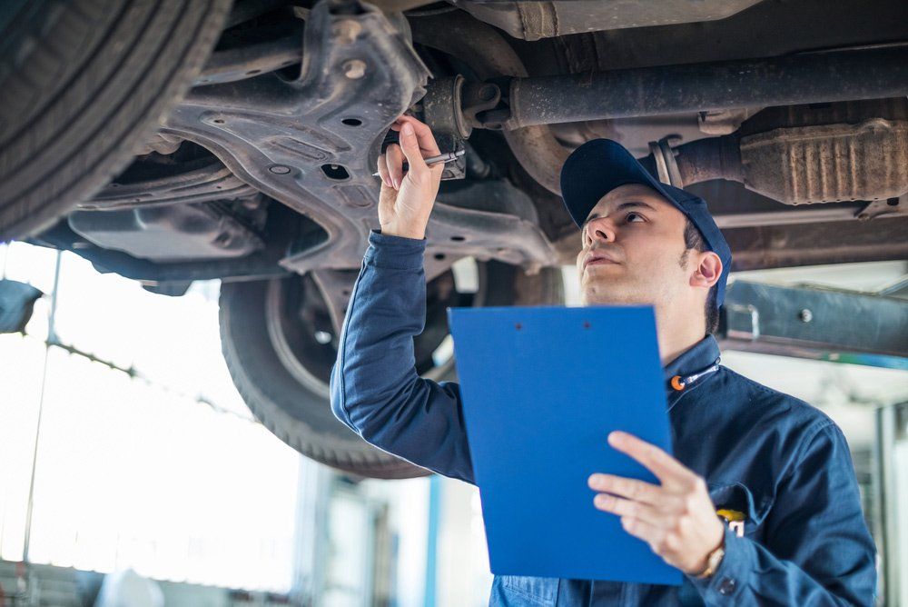 Mechanic at Work in his Garage — Roadworthy Certificates in West Gosford NSW
