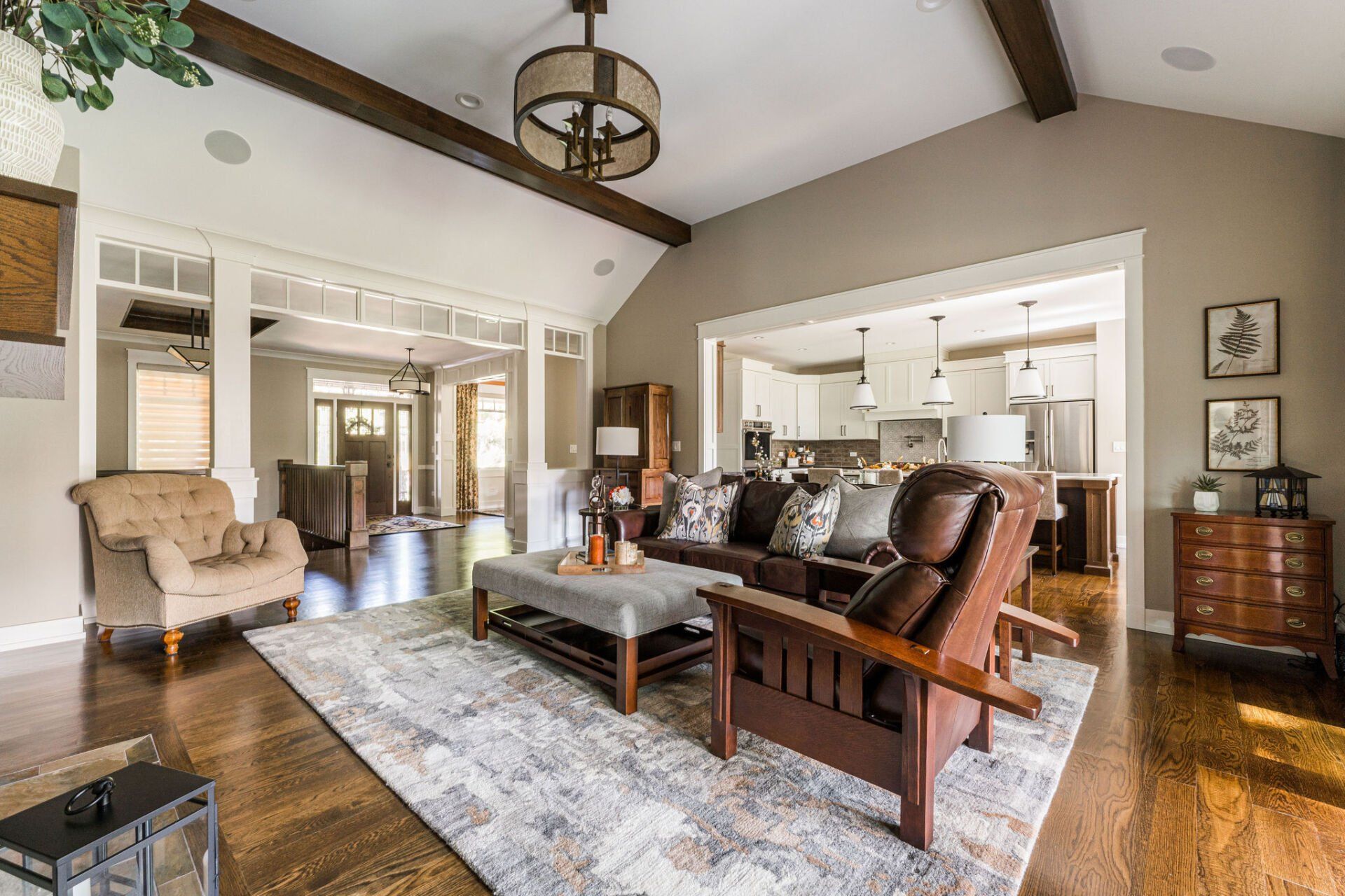 A living room filled with furniture and a rug.