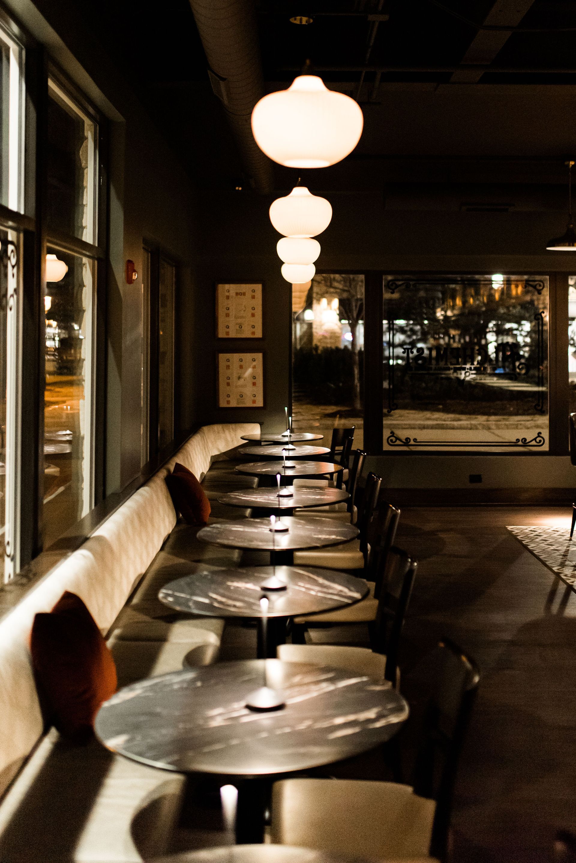 A restaurant with a lot of tables and chairs