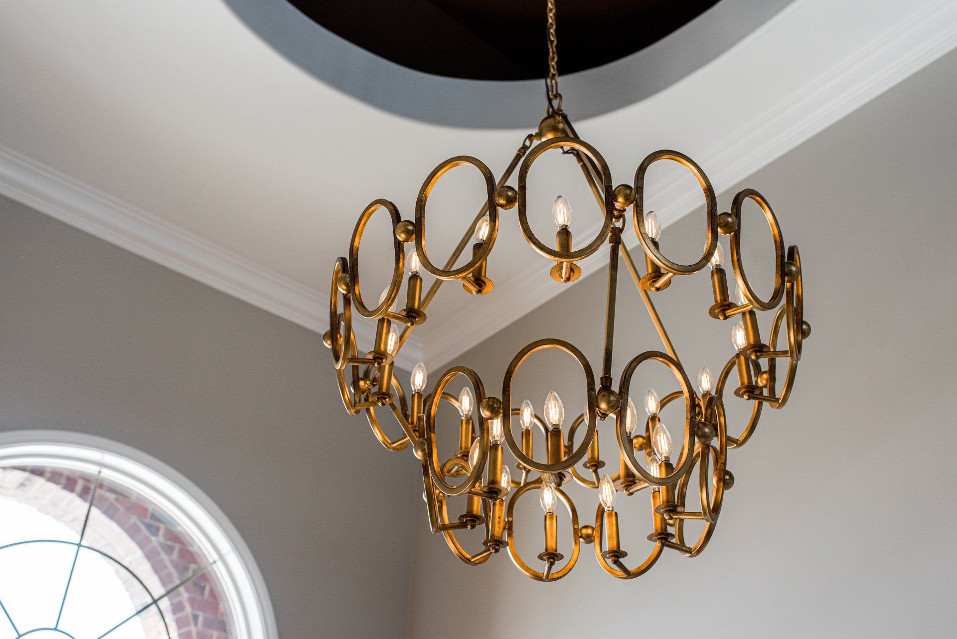 A large chandelier is hanging from the ceiling in a room.