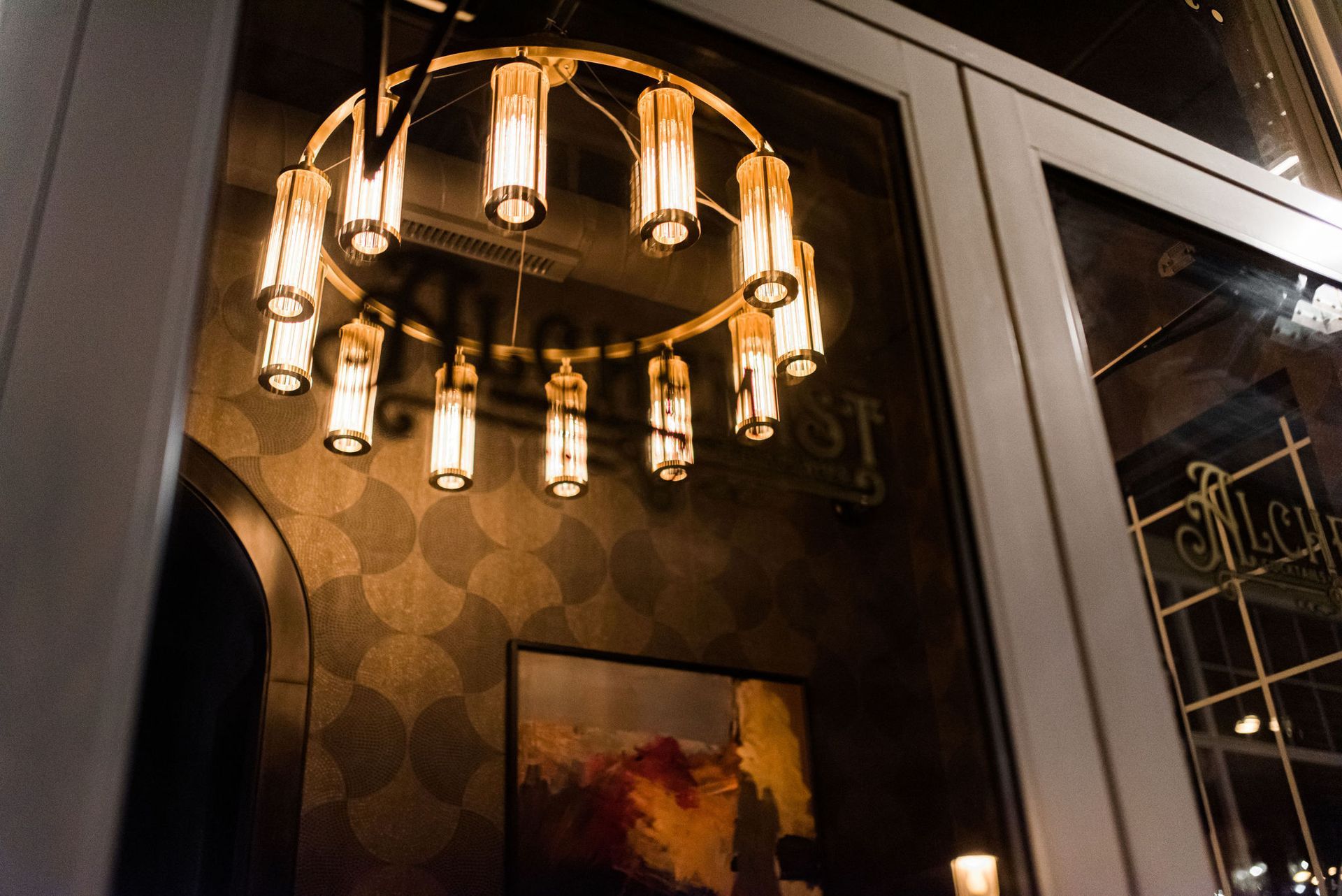 A chandelier is hanging from the ceiling in a dark room