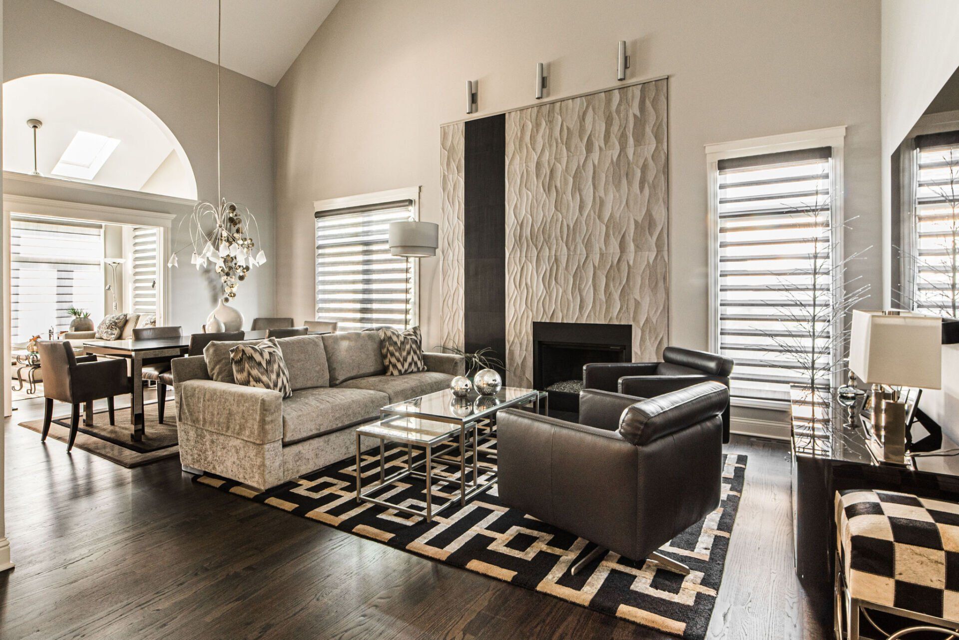 A living room filled with furniture and a fireplace.