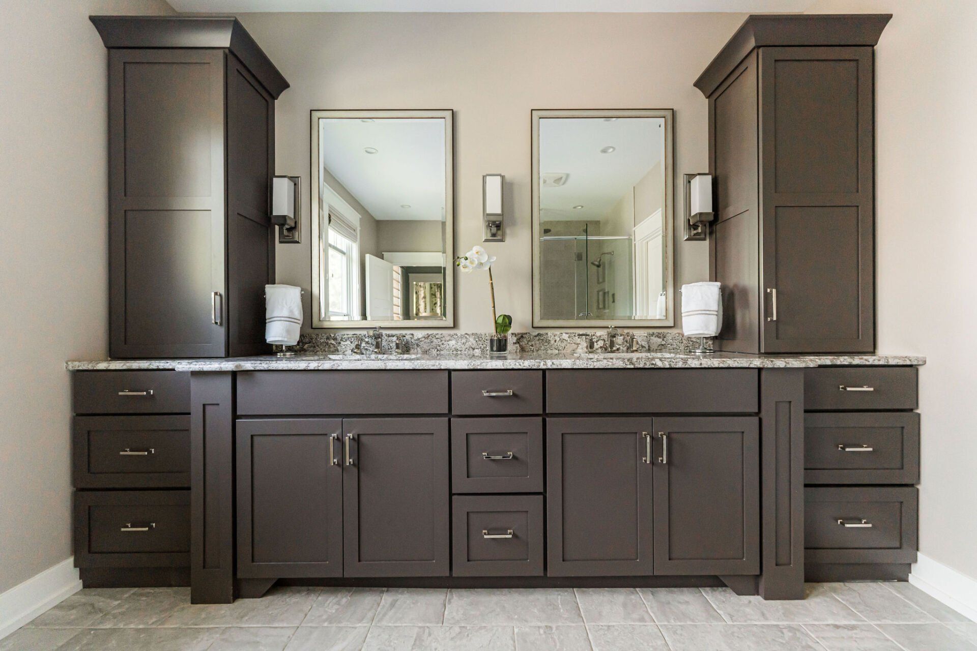 A bathroom with two sinks and two mirrors.