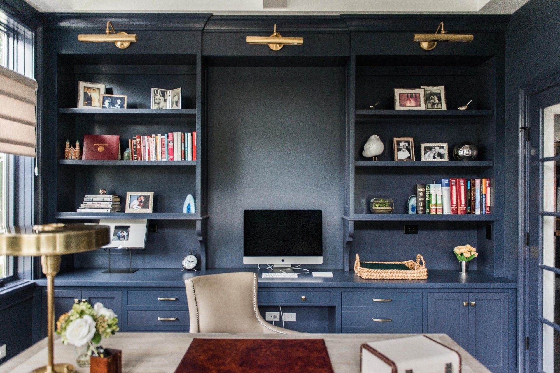 A home office with a desk and a computer on it
