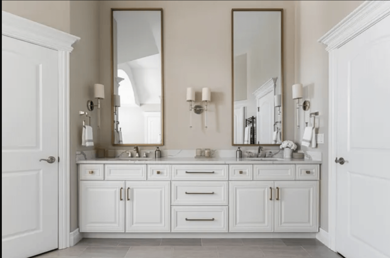 A bathroom with two sinks and two mirrors.