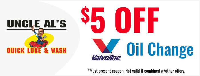 Uncle Al’s Quick Lube & Wash ad offering $5 off Valvoline oil change, red and blue text on white background