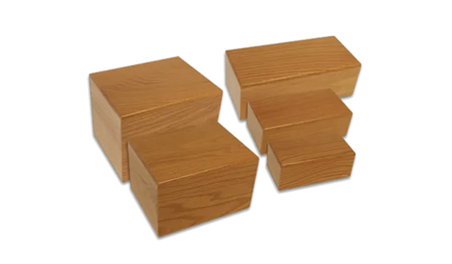 Two small wooden puzzle blocks with stepped interlocking cuts on a white background