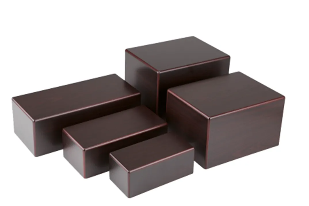 Assorted dark chocolate pieces arranged in a stack on a white background