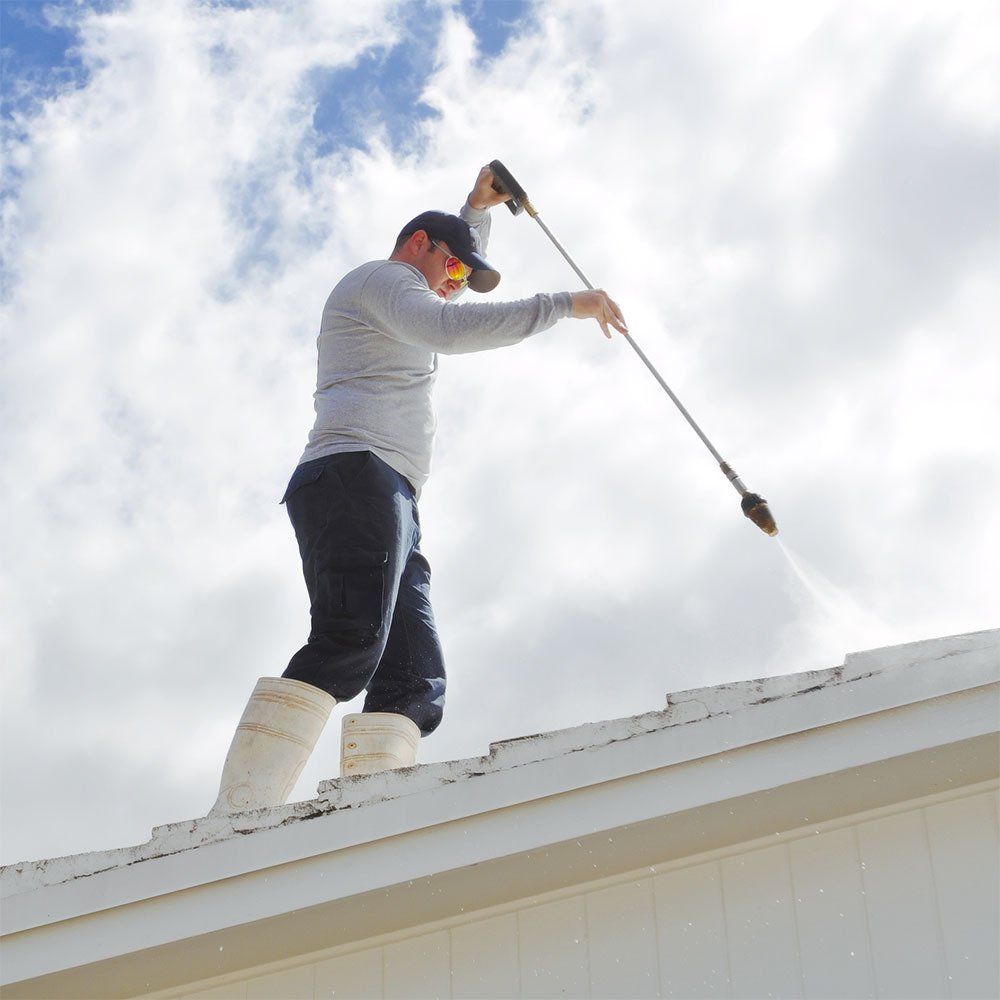 A Man Cleaning The Roof — Springfield, IL — Midwest Power/Soft Washing A Man Cleaning The Roof — Springfield, IL — Midwest Power/Soft Washing