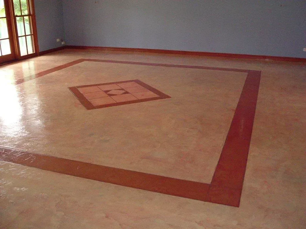 An Empty Room with A Square Design on The Floor — Concrete Colour Solutions in Central Coast, NSW