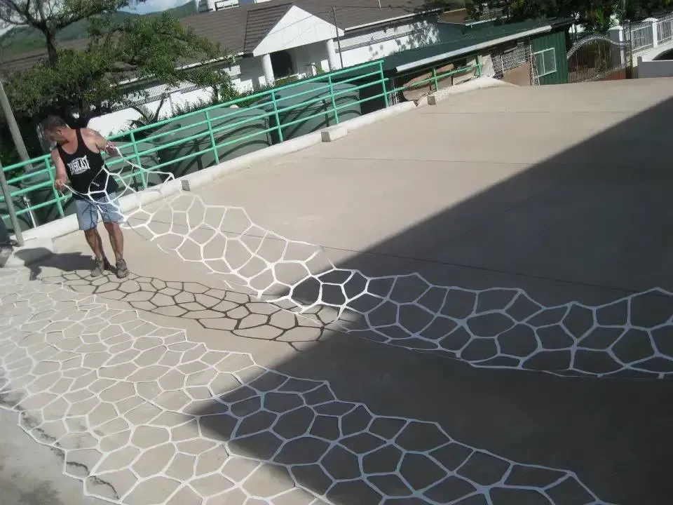 A Man Holding Concrete Stencil — Concrete Colour Solutions in Nelson Bay, NSW