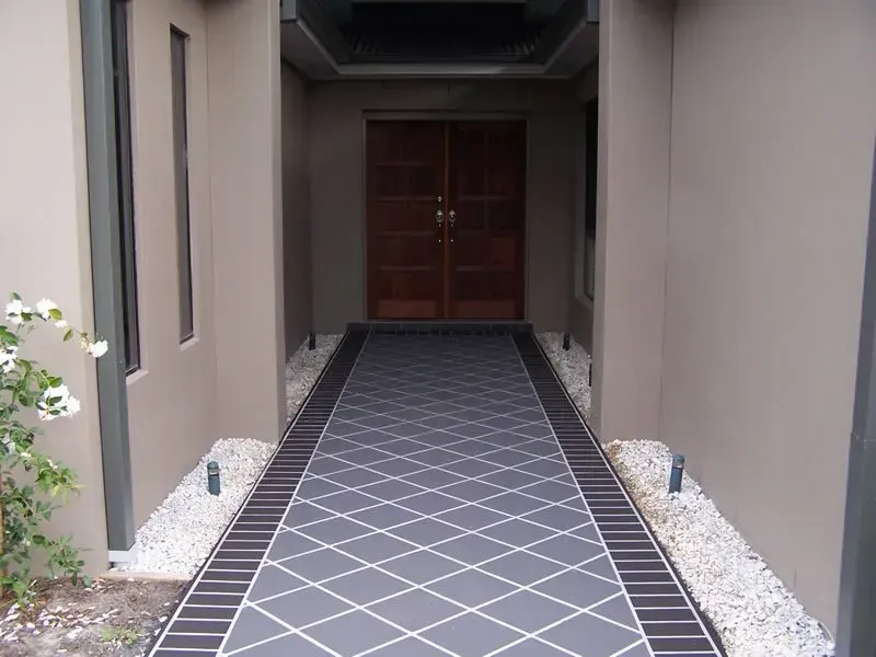 A walkway leading to the front door of a house — Concrete Colour Solutions in Morisset, NSW