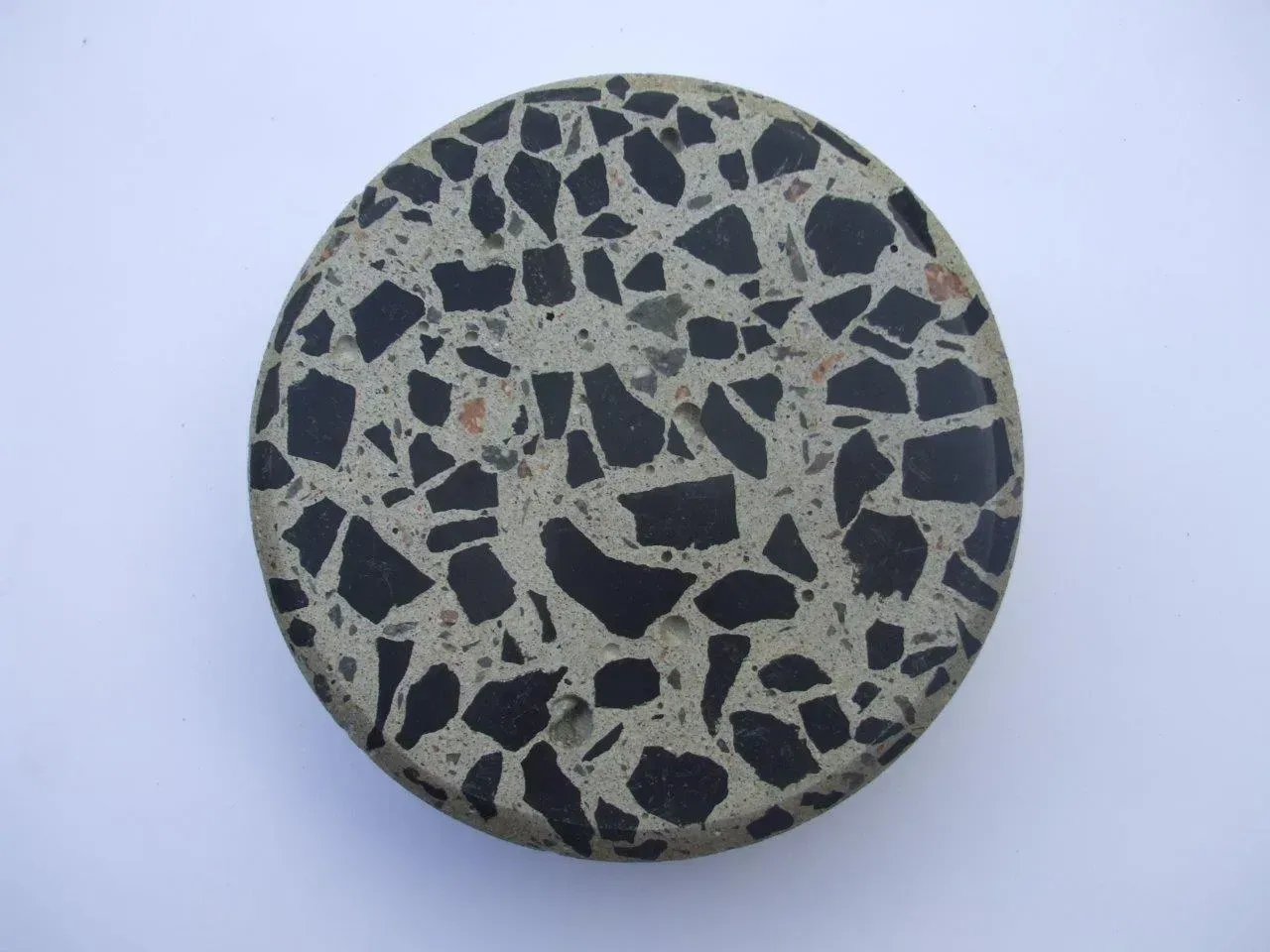 A circular object with a black and white pattern on it — Concrete Colour Solutions in Morisset, NSW