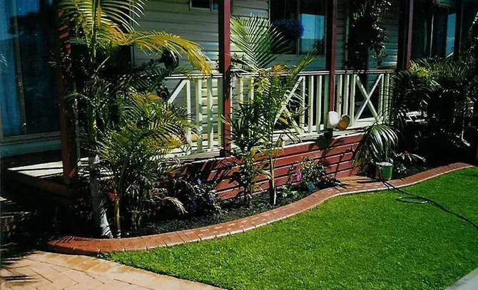 Front Yard With Green Lawn, Brick Planter, White Railing — Concrete Colour Solutions in Muswellbrook, NSW