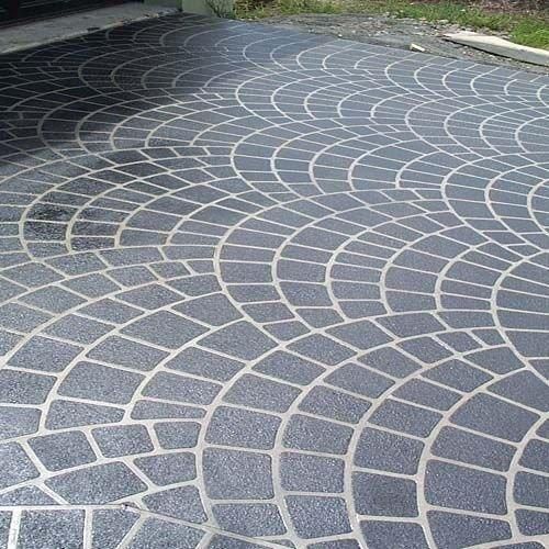 Curved Gray Stone Pavers With White Grout Forming a Decorative Pattern — Concrete Colour Solutions in Muswellbrook, NSW