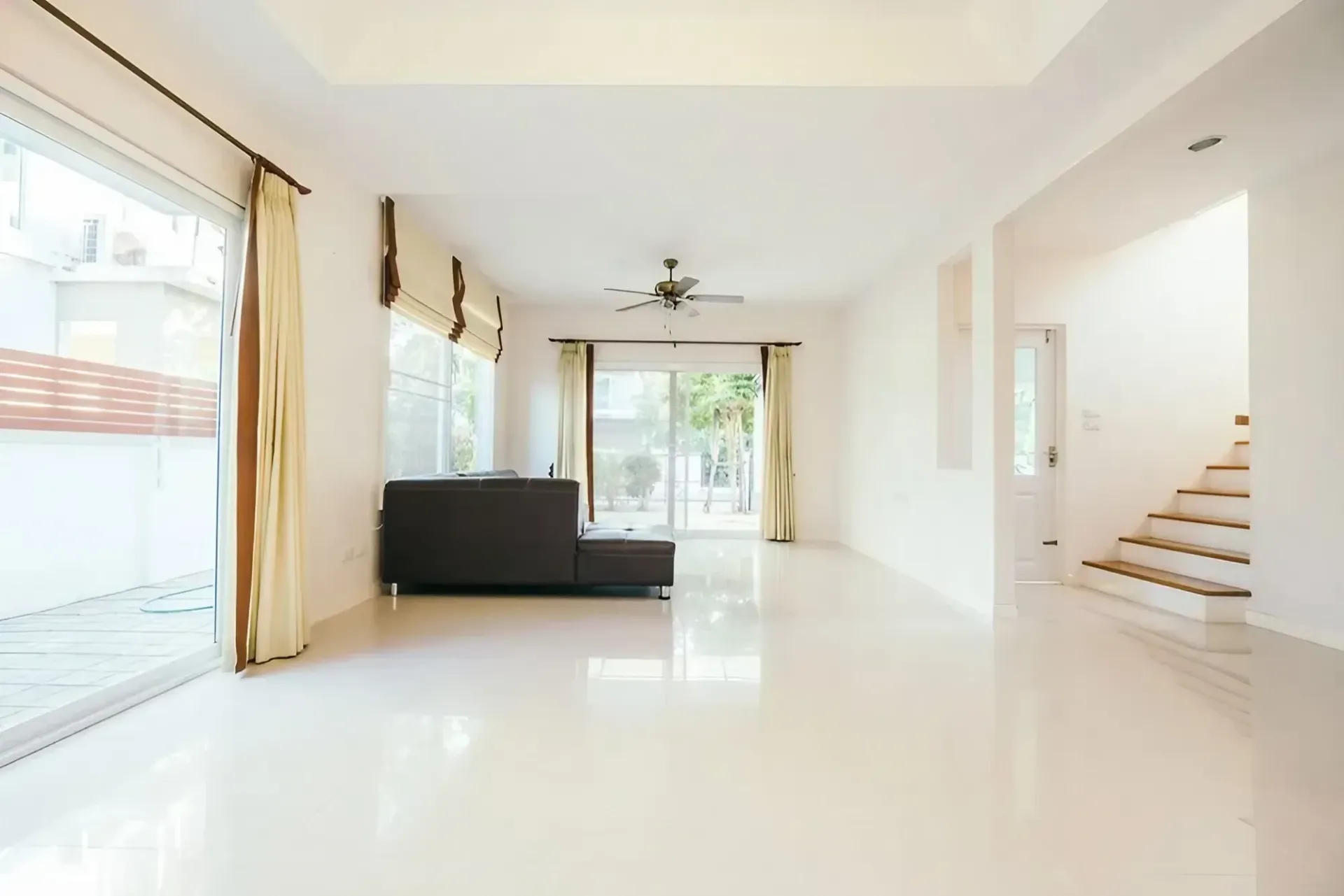 Bright, Empty Living Room With Glossy White Floors — Concrete Colour Solutions in Scone, NSW