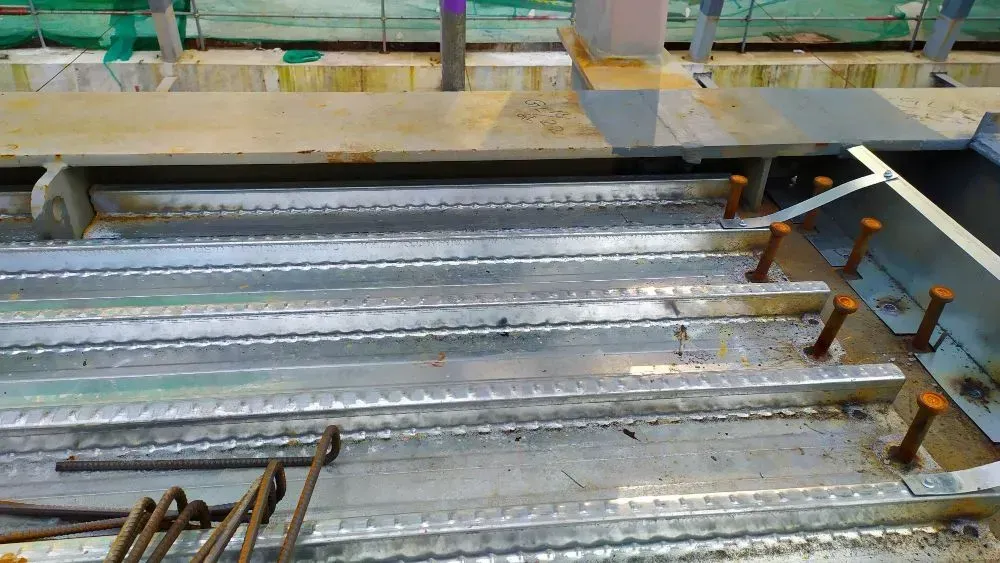 A Close up Of a Metal Structure with Screws in It — Concrete Colour Solutions in Raymond Terrace, NSW
