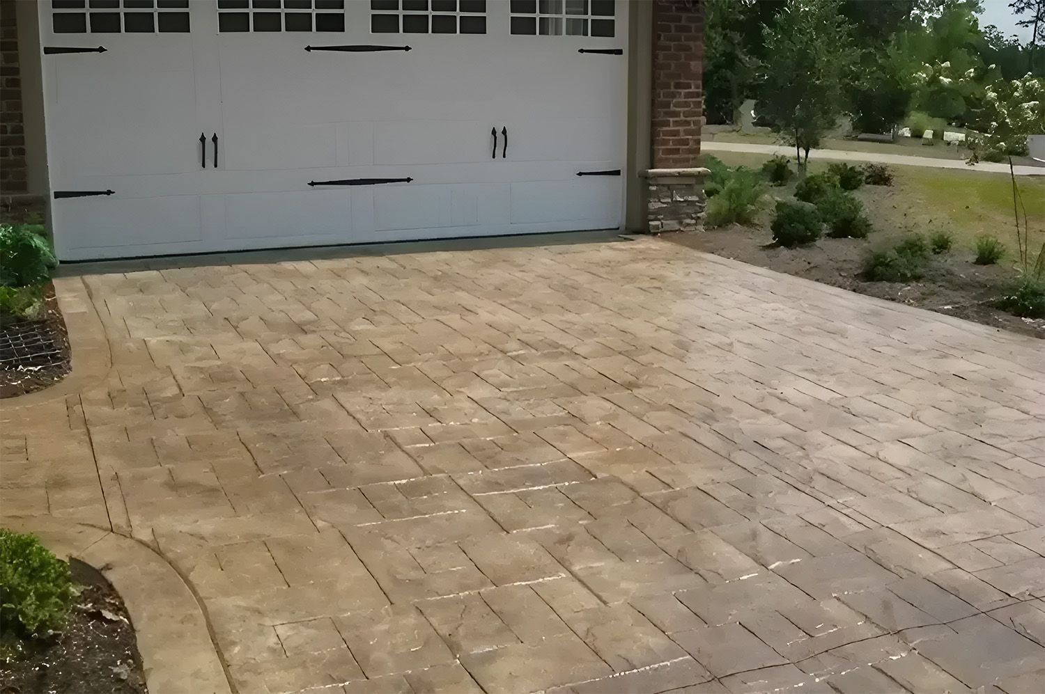 Tan Stone Paver Driveway Leading to a White Double Garage — Concrete Colour Solutions in Singleton, NSW