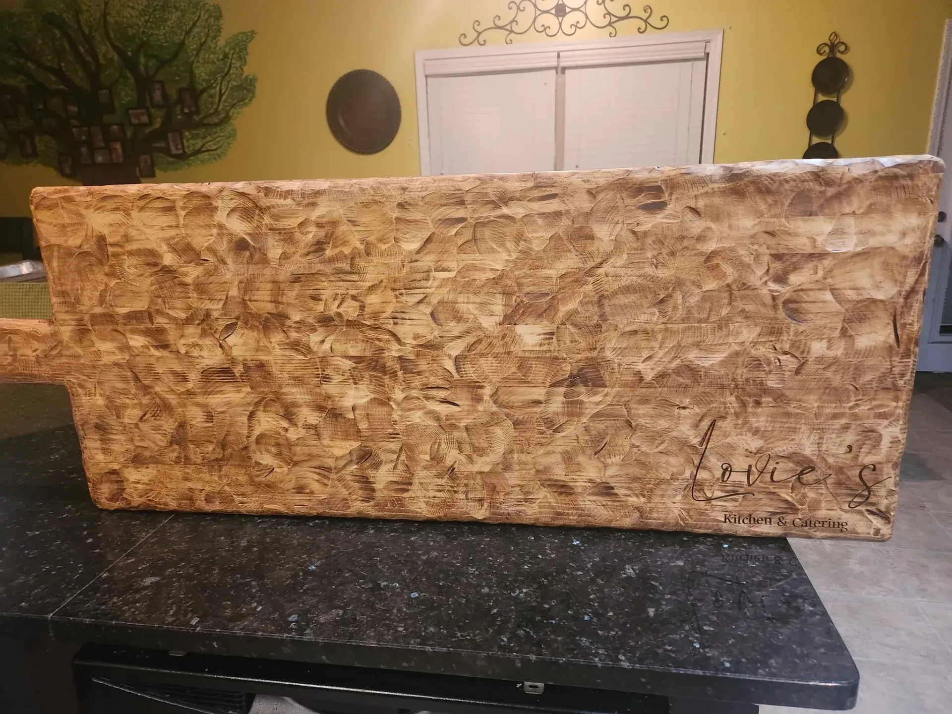 Rectangular cardboard box on a dark countertop in a kitchen