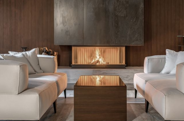 Two Cream-coloured Couches Face Each Other in Front Glowing Fireplace — The Flue Pro In Huntingfield, TAS