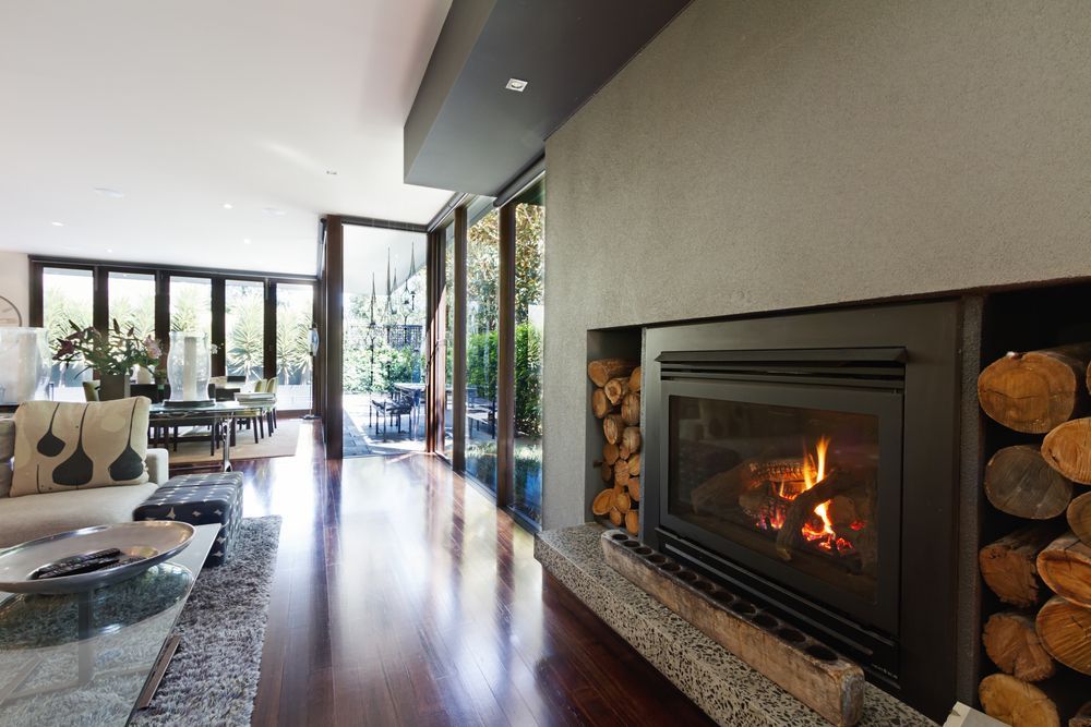 A Modern Living Room With a Fireplace, Built-in Log Storage — The Flue Pro In Huntingfield, TAS
