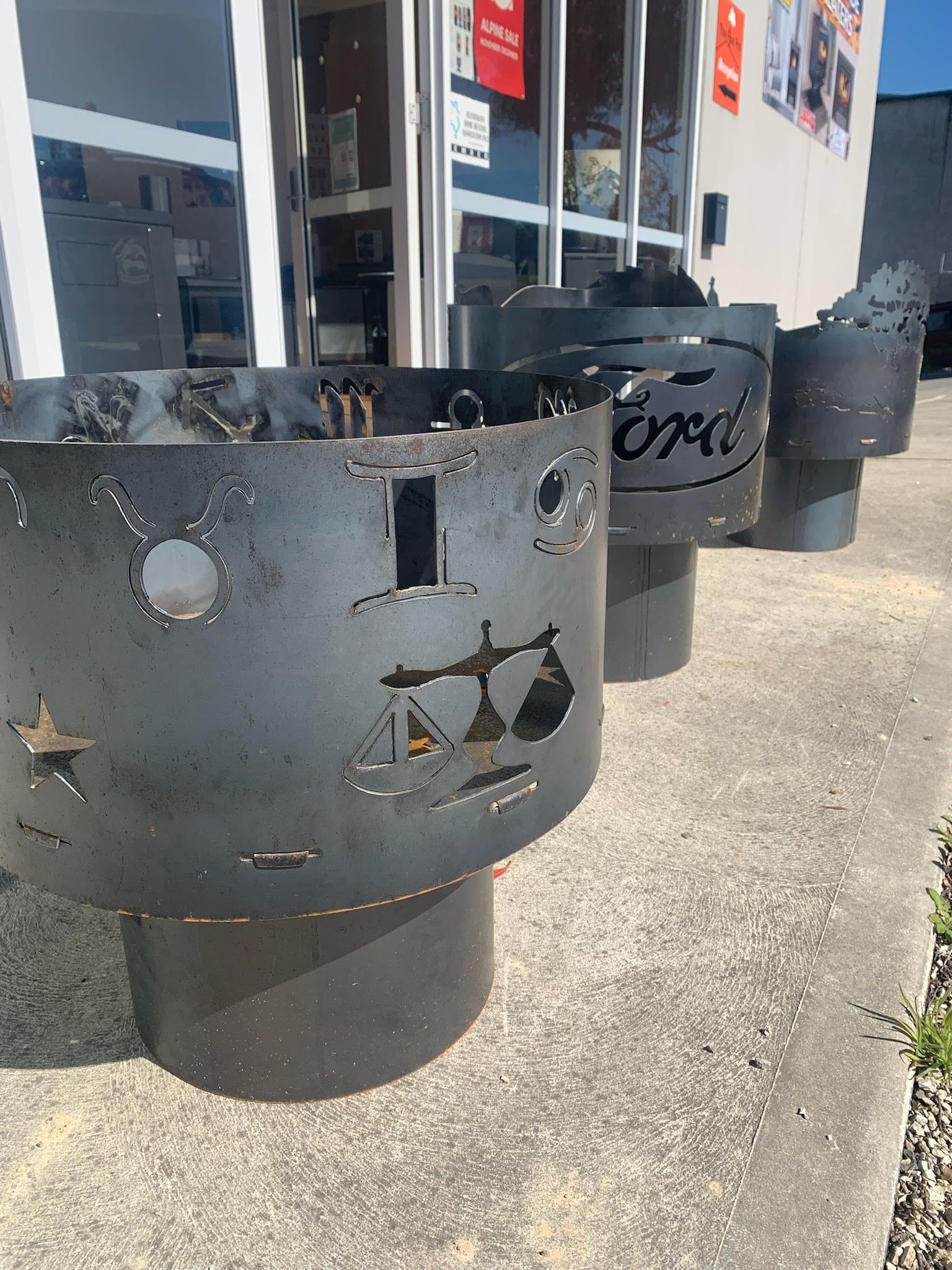 Several Cylindrical Steel Fire Pits With Laser-cut Designs — The Flue Pro In Huntingfield, TAS