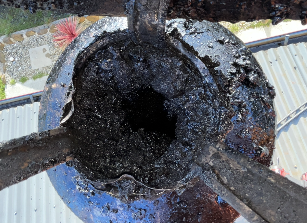 Close-up of a Burnt, Blackened Circular Metal Opening — The Flue Pro In Burnie, TAS