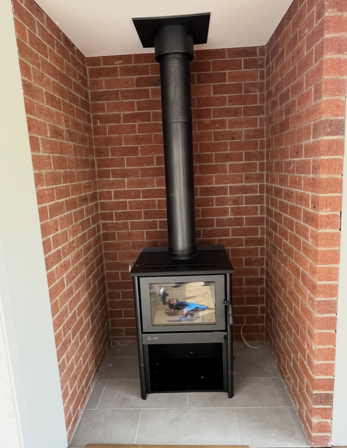 Black Wood-burning Stove With Tall Flue — The Flue Pro In Devonport, TAS