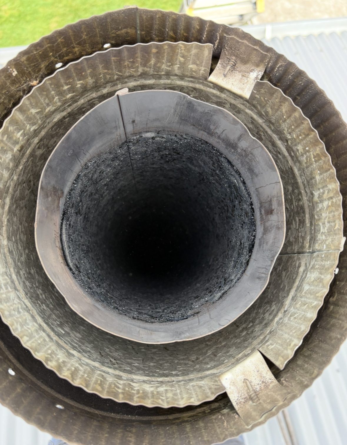 Top-down View of a Circular Metal Pipe — The Flue Pro In Huntingfield, TAS