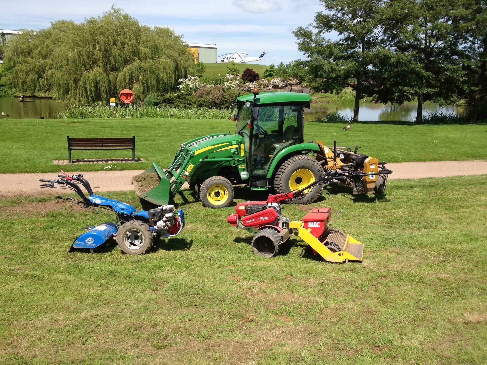 CDTS's specialist equipment lined up outside the JCB factory. Blec seed drill & John Deere tractor with stone burier.