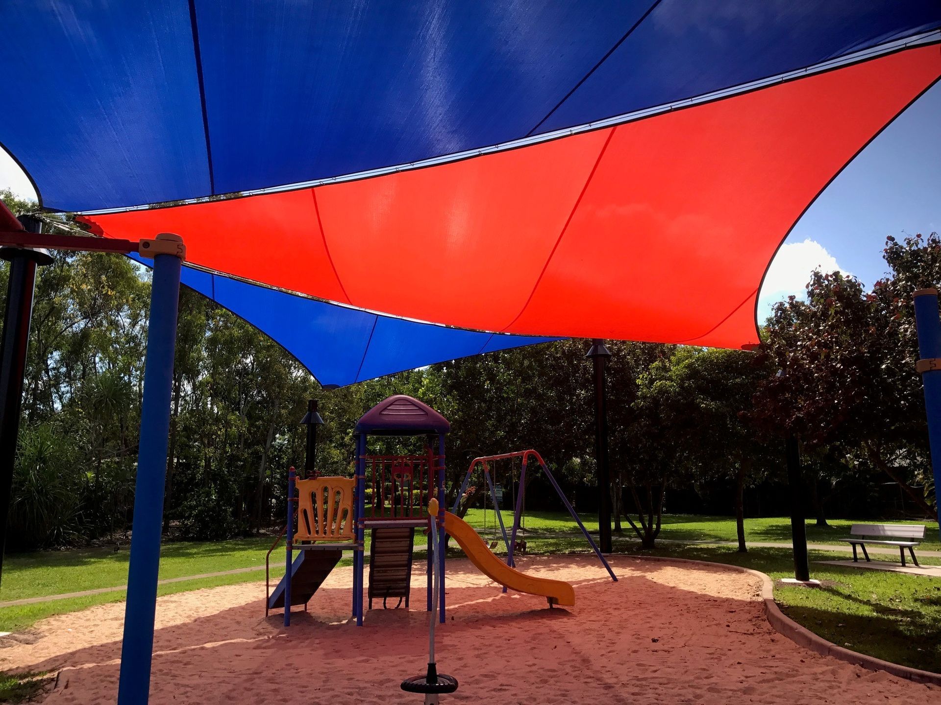 A Row Of Colorful Umbrellas Against A Blue Sky — Aerosail Engineered Fabric Structures In Winnellie, NT
