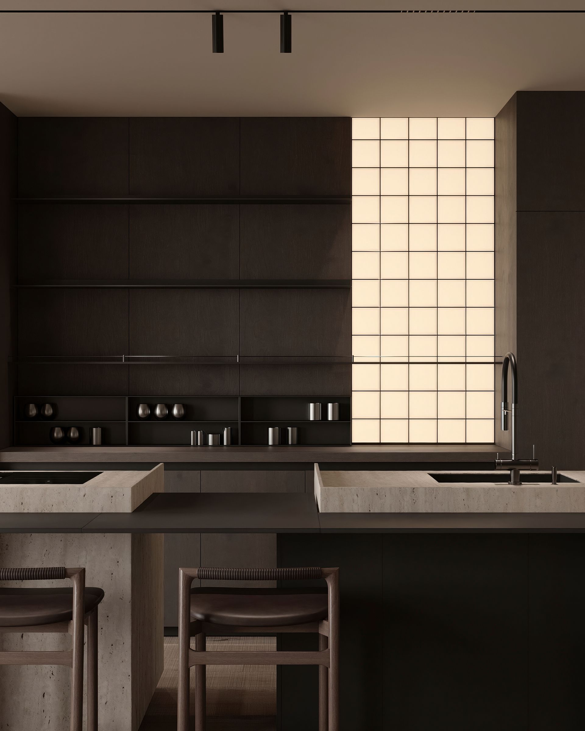 Modern kitchen with dark cabinetry and concrete countertops, illuminated by natural light.