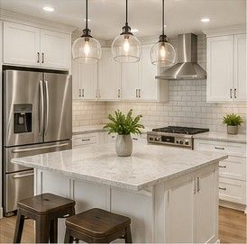 Bright modern white kitchen with marble island, stainless appliances, and three pendant lights