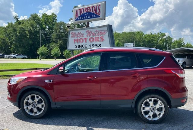 Red Ford Escape SUV parked in front of