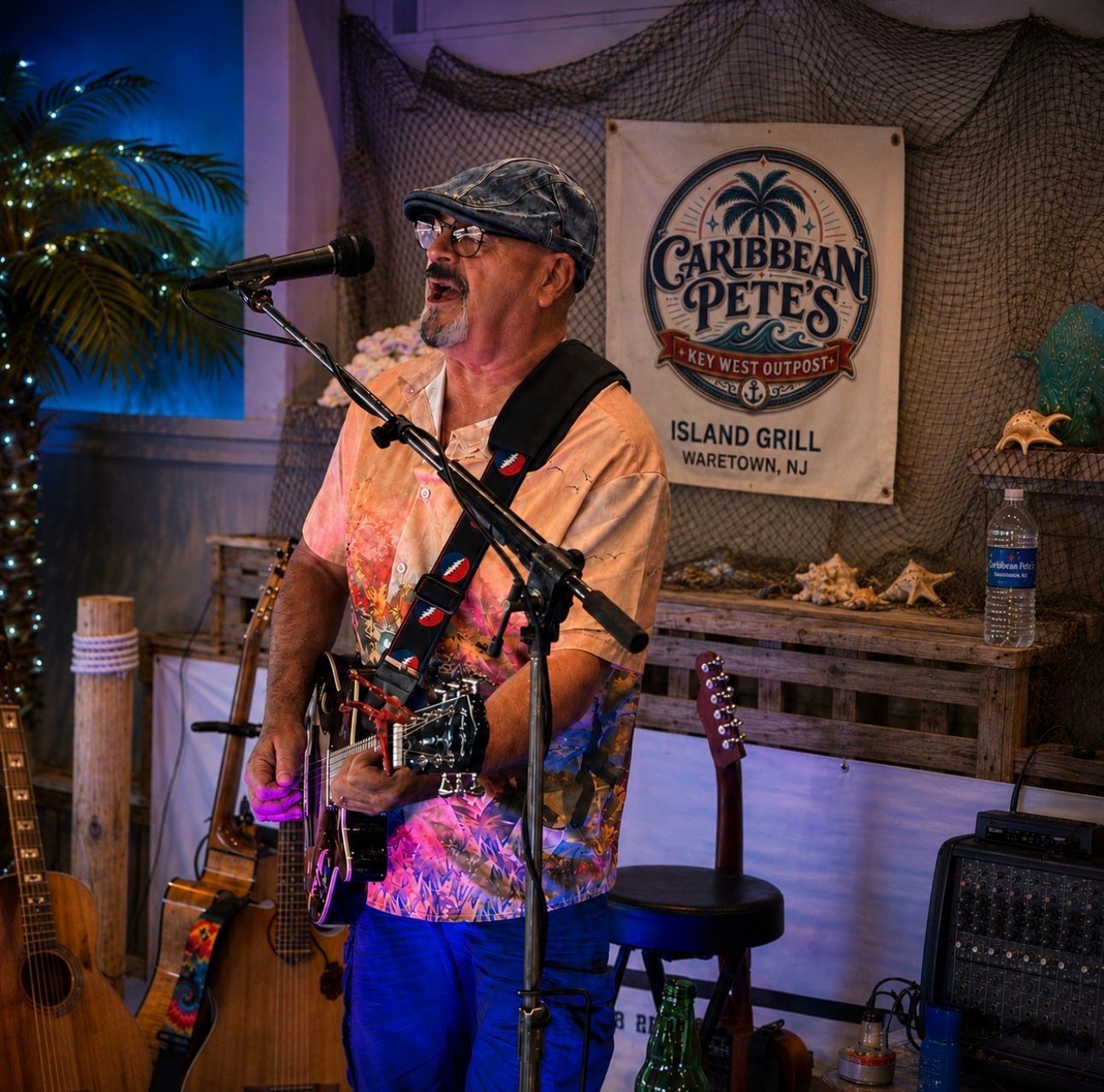 Musician singing and playing guitar at Caribbean Pete’s Island Grill