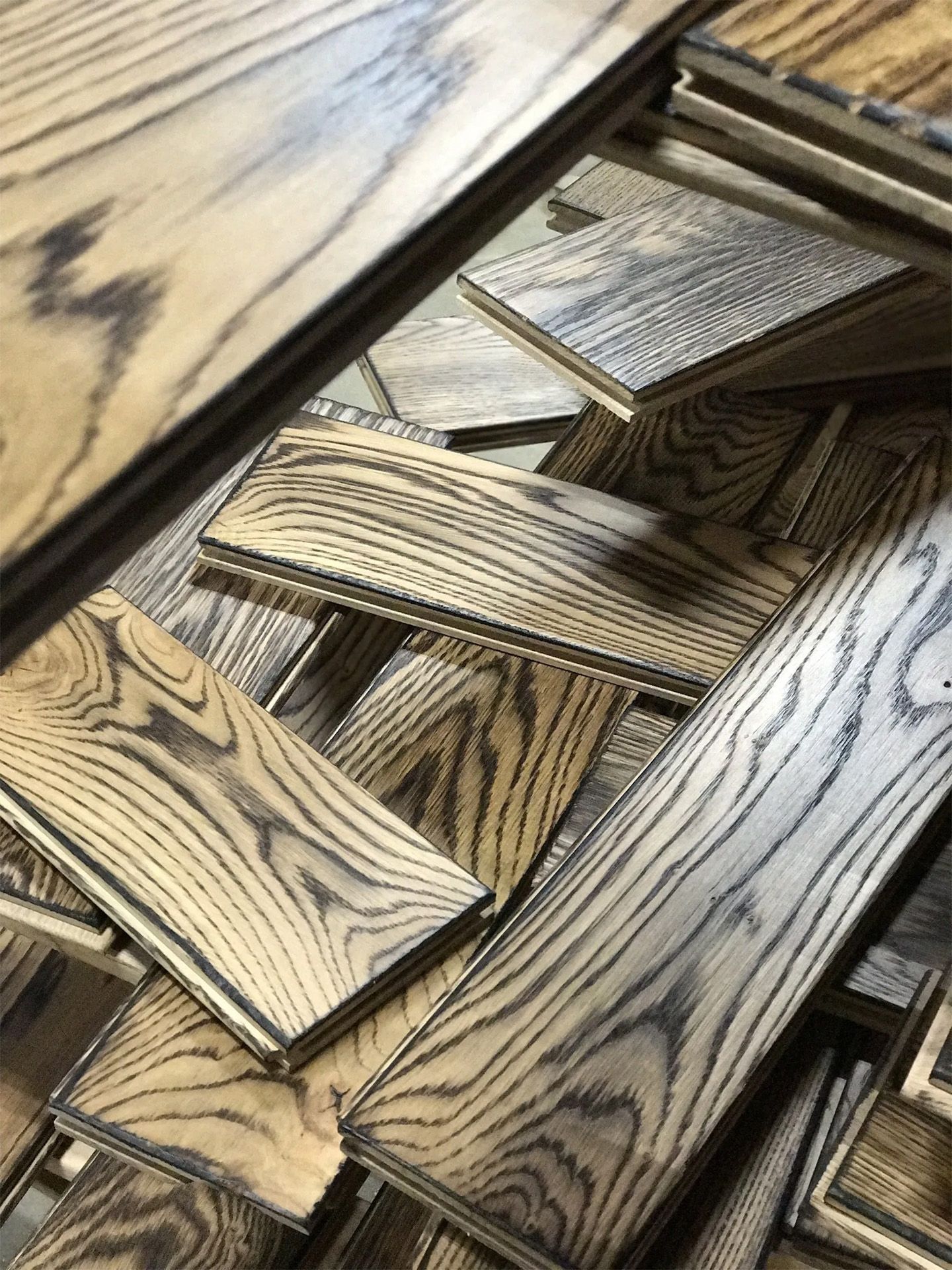 Interlocking wood-patterned panels stacked in a geometric arrangement